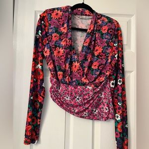 Floral top with 2 pretty patters. V neck opening in front.
